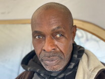 Micheal Banyard is shown in an upclose photo of his face looking directly into the camera.