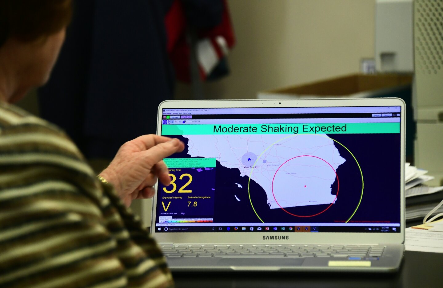 Margaret Vinci, manager of the Seismological Laboratory at California Institute of Technology (Caltech) points to a shake alert user display on a laptop screen, set for a limited release on June 1, 2017 at the Caltech Seismological Laboratory in Pasadena, California, where they addressed the elimination of federal funding for the West Coast Earthquake early Warning system, also known as ShakeAlert, in President Trump's FY2018 budget. / AFP PHOTO / FREDERIC J. BROWN        (Photo credit should read FREDERIC J. BROWN/AFP/Getty Images)