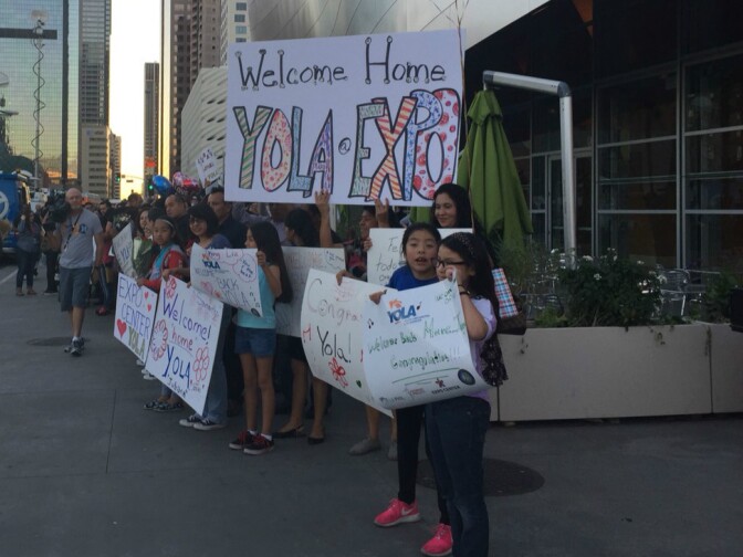 Families lined up outside of Disney Hall to welcome students back into town.