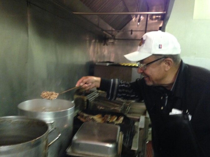 Dargin McWhorter, owner of Big Mama's Rib Shack in Pasadena, with a pot of black-eyed peas. Eating black-eyed peas on New Year's Day is a Southern tradition, said to bring luck and prosperity.