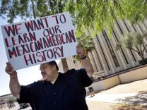 Carlos Galindo protests Monday, May 9, 2011 outside the Arizona Department of Education in Phoenix, along with other supporters of an ethnic studies program in the Tucson Unified School District.