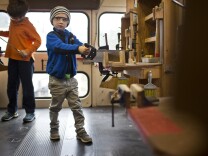 Emmett Joanon, 5, saws a propeller at Side Street Projects in Pasadena on Thursday, May 7, 2015. The mobile arts program serves more than 2,500 children each year.