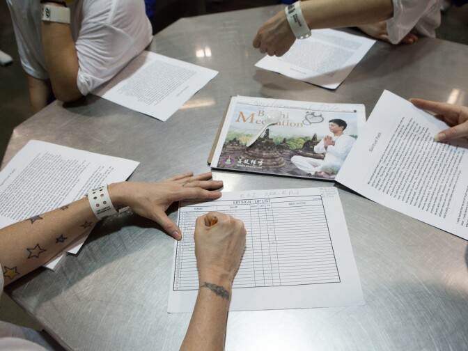 Women sign up for the Education Based Incarceration program at the Twin Towers Correctional Facility on October 2nd, 2013.