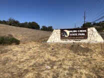 Deputies say a burglar suspect first spotted a week ago may be linked to an unsolved murder at the park's campground in June.