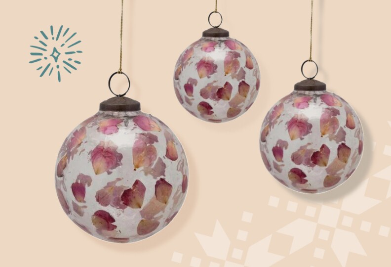Delicate glass ornaments are embossed with rose petals