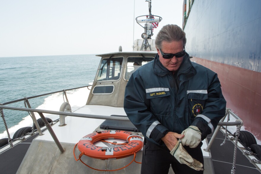 Port Pilot Brett McDaniels prepares to get onto a large cargo vessel at The Port of Los Angeles
