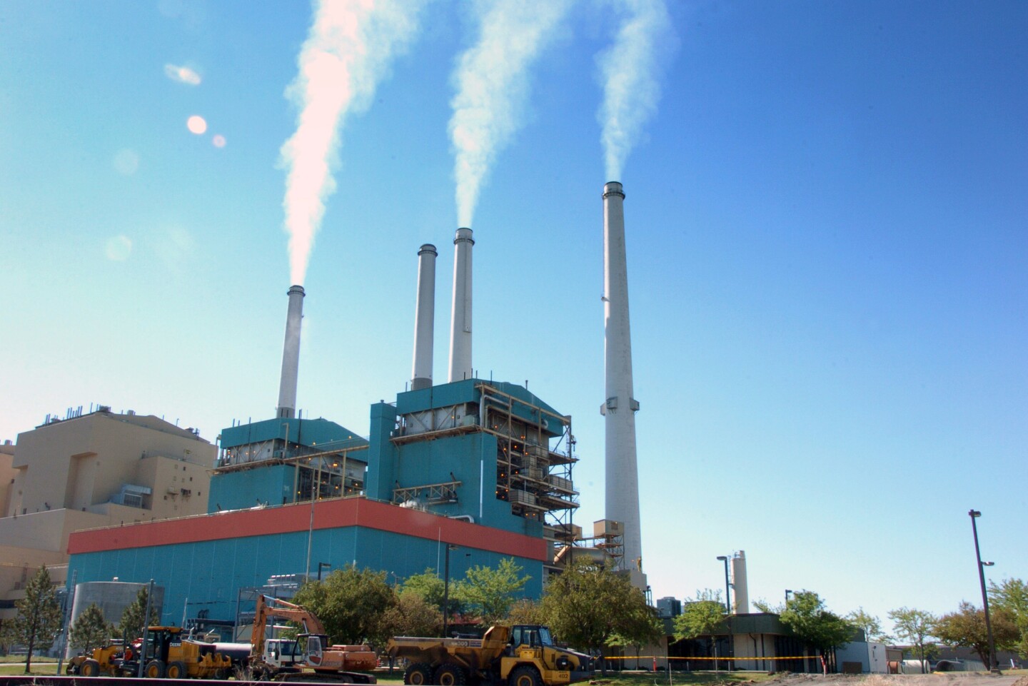 FILE - In this July 1, 2013, file photo,  smoke rises from the Colstrip Steam Electric Station, a coal burning power plant in in Colstrip, Mont. State officials planned a public meeting Tuesday, Sept. 30, 2014, in Colstrip on the U.S. Environmental Protection Agency proposal to cut greenhouse emissions. The town is home to one of the largest coal-fired power plants in the West,  a 2,100-megawatt facility that churns out more greenhouse gases than any other source in Montana. (AP Photo/Matthew Brown, File)