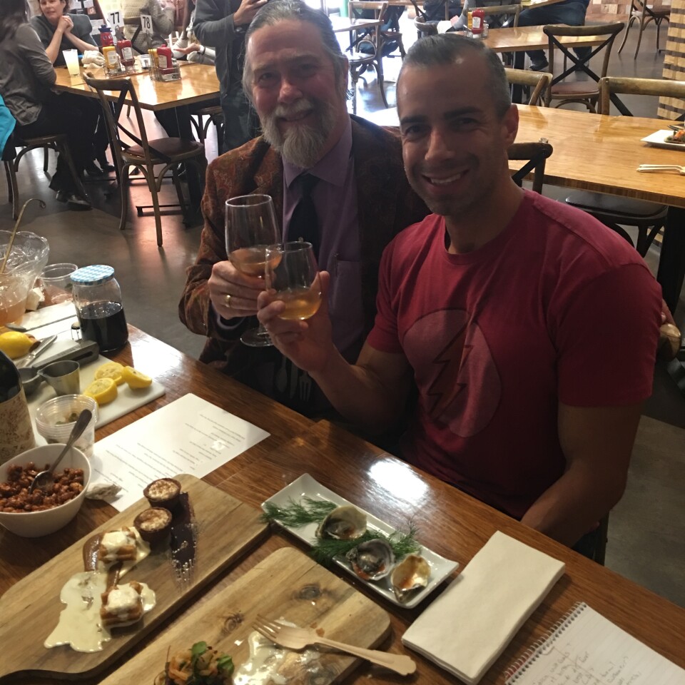 A Martinez toasts with Richard Foss, Culinary historian with the Autry Museum.