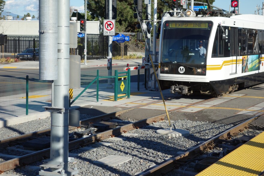 An Expo Line train heads out of Farmdale Station heading for Culver City.