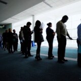 Job seekers line up to enter Choice Career Fair at the Los Angeles Convention Center on December 1, 2010 in Los Angeles, California.