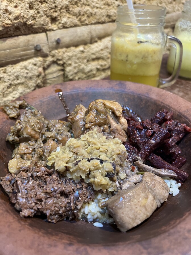 Food served in a clay pot. 