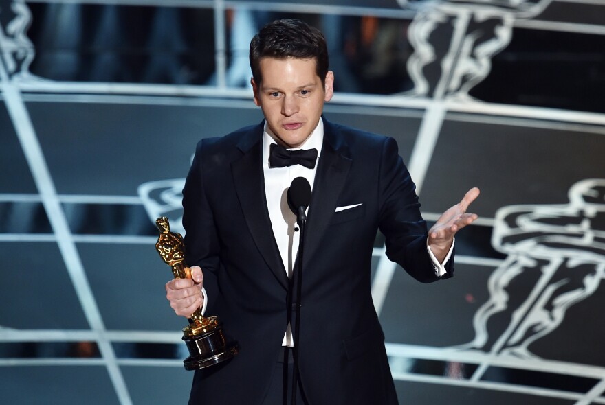 Screenwriter Graham Moore accepts the Best Adapted Screenplay Award for "The Imitation Game" onstage during the 87th Annual Academy Awards at Dolby Theatre on February 22, 2015 in Hollywood, California.