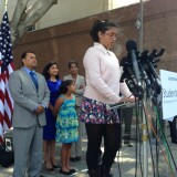 In this file photo, Julia Macias, one of nine plaintiffs in the Vergara v. California trial, welcomes a judge's ruling in June striking down teacher job protections.