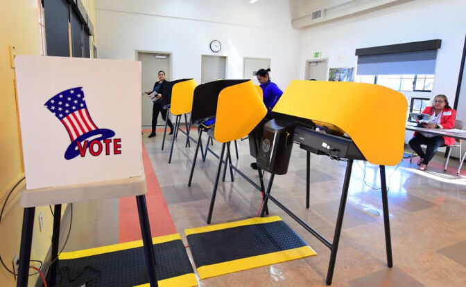 People cast their ballots at the South Whittier Community Resource Center in Whittier, California for the presidential primary on Super Tuesday, March 3, 2020. - Fourteen states and American Samoa are holding presidential primary elections, with over 1400 delegates at stake. Americans vote Tuesday in primaries that play a major role in who will challenge Donald Trump for the presidency, a day after key endorsements dramatically boosted Joe Biden's hopes against surging leftist Bernie Sanders. The backing of Biden by three of his ex-rivals marked an unprecedented turn in a fractured, often bitter campaign. (Photo by Frederic J. BROWN / AFP) (Photo by FREDERIC J. BROWN/AFP via Getty Images)