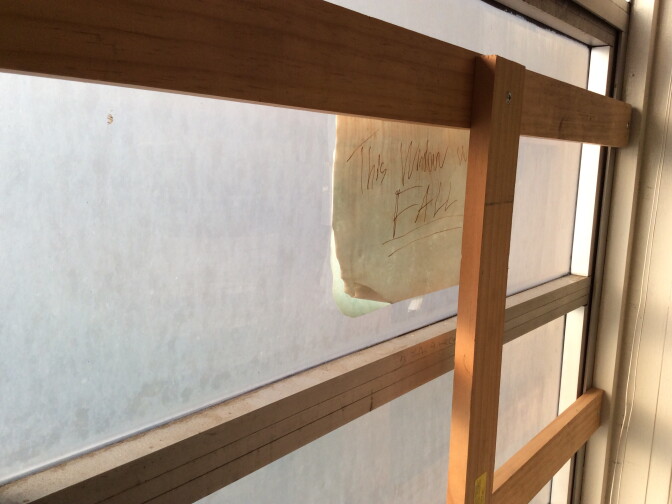 An inspector's photo shows a damaged window in a classroom at Inglewood High School.