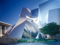 The Walt Disney Concert Hall has swooping curves and an eye-catching, and sun-reflecting metallic exterior.