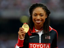Gold medalist Allyson Felix of the United States poses on the podium during the medal ceremony for the Women's 400 metres final during day seven of the 15th IAAF World Athletics Championships Beijing 2015 at Beijing National Stadium on August 28, 2015 in Beijing, China.