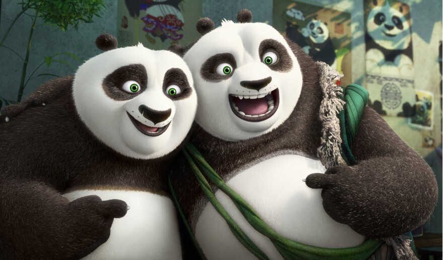 (L-R) Po (voiced by Jack Black) and his long-lost panda father Li (voiced by Bryan Cranston) pose for a portrait in DreamWorks Animation's KUNG FU PANDA 3.