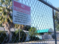 A fence surrounds a defunct private school in Winnetka where a developer hoped the city would fast-track 360 new low-income apartments.