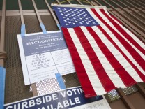Election signs and a flag are posted on the gate at Angeles Mesa Elementary school during a special run-off election for the Los Angeles Unified School District board of education seat in District 1.