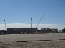 Signs of a construction industry rebound include these cranes alongside Highway 60 in Moreno Valley. They are building a new mega-warehouse and regional headquarters for Aldi as the discount grocery chain expands in California and the west.