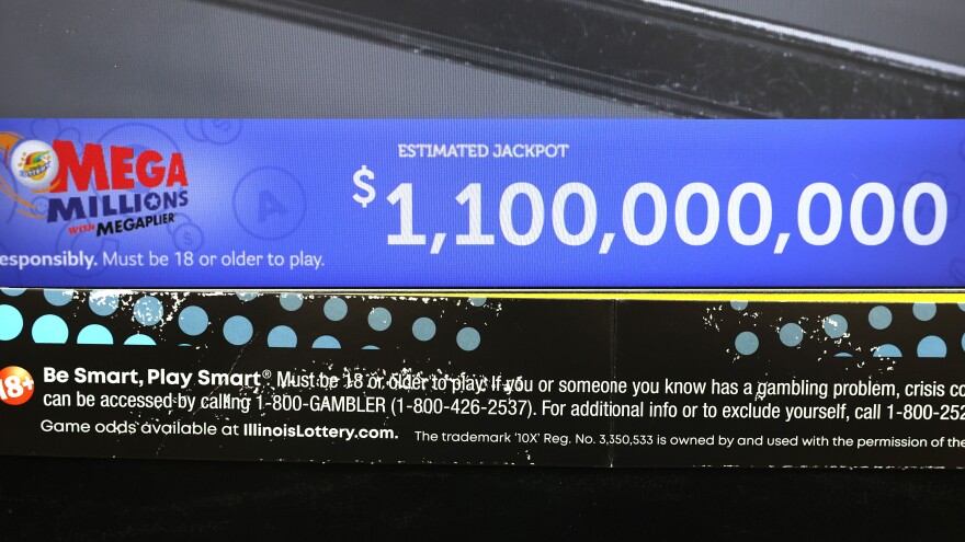 A Mega Millions sign lists an estimated jackbot of $1,100,000,000