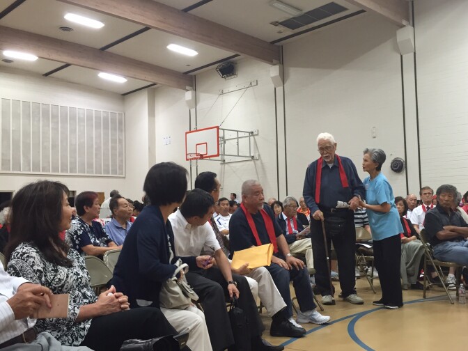 Frank Omatsu, the last surviving founder of the Keiro non-profit, is seated at the front of the auditorium.