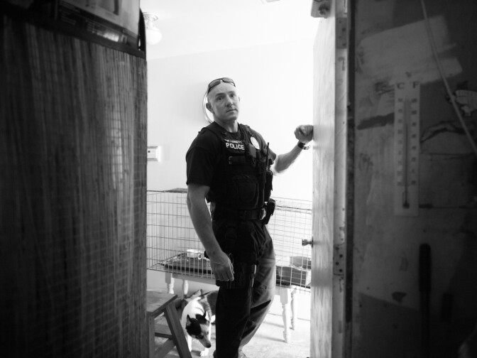 Sergeant Corbett searches a home in Corona, Calif. on June 20th, 2013.