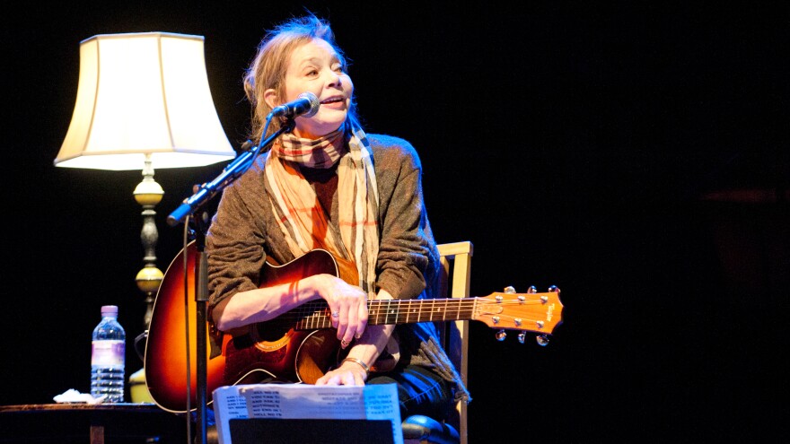 Nanci Griffith performs in London in 2012. She died Friday in Nashville at age 68.