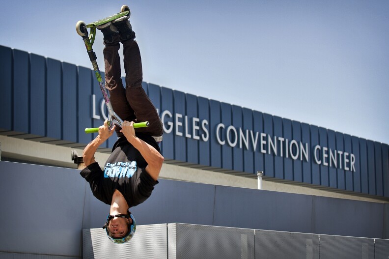 Chandler Dunn of Temecula does a flip on a Razor during the first day of X Games Los Angeles outside STAPLES Center and L.A. Live.