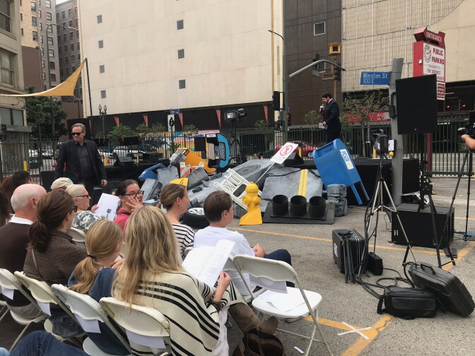 A crowd watched as the War of the Worlds performance began in a parking lot in downtown L.A. across the street from a decommissioned air raid siren. Set design by Calder Greenwood. Photo credit: Adriana Cargill