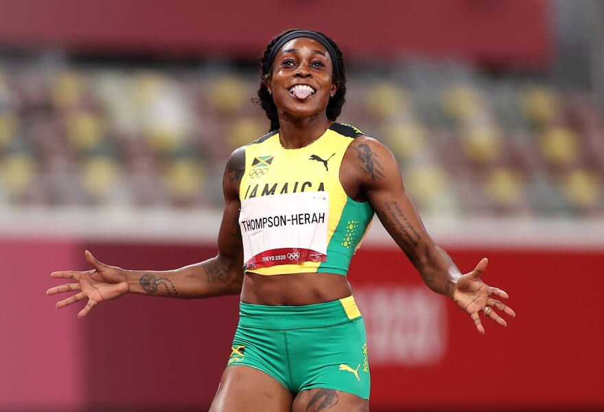 Elaine Thompson-Herah of Team Jamaica celebrates after winning the gold medal in the Women's 200m Final on day eleven of the Tokyo 2020 Olympic Games at Olympic Stadium on August 03, 2021 in Tokyo.