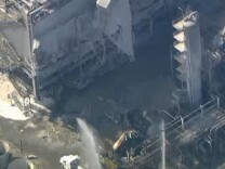 Aerial footage from NBC4 showed firefighters responding to the scene of an explosion at the ExxonMobil refinery in Torrance, Calif., on February 18, 2015.