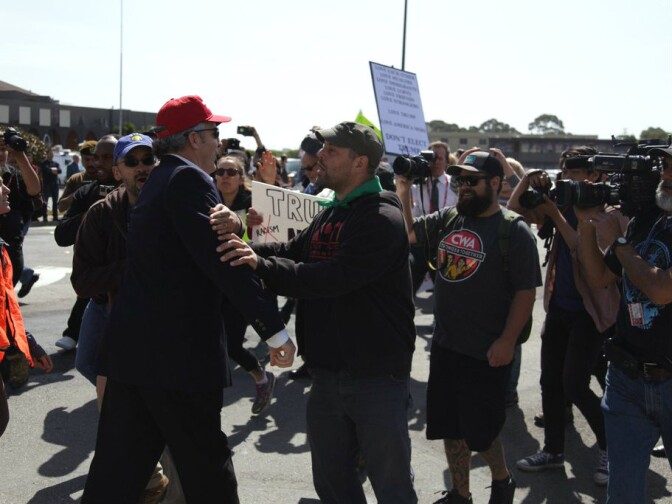 Trump supporter Christopher Conway of Burlingame gets into a skirmish with protesters on Friday, April 29, 2016.