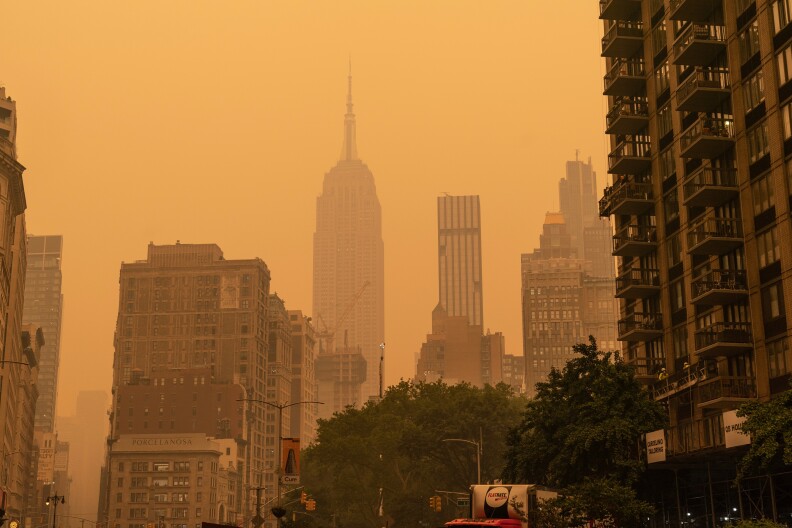 Distinctive New York skyline is shrouded in a red haze