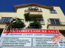 A "bank foreclosure sale" sign is posted in front of townhomes on August 12, 2010 in Los Angeles, California. 