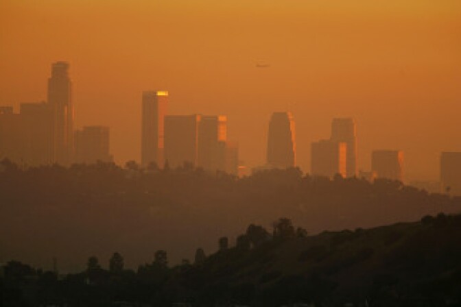 The downtown skyline is enveloped in smog shortly before sunset on in Los Angeles, California. File photo.
