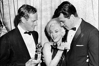 Charlton Heston, with Marilyn Monroe (center) and Rock Hudson, after Heston and Monroe won Golden Globes awards.