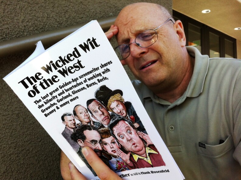 Off-Ramp commentator Hank Rosenfeld with the book he co-wrote with Irv Brecher, the original Old Jew Telling Jokes. (Photo: John Rabe)