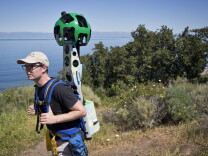 Kirk Klausmeyer, a climate scientist with The Nature Conservancy, wears Google's Trekker during a hike in the Santa Cruz Islands on Thursday, March 26, 2015.