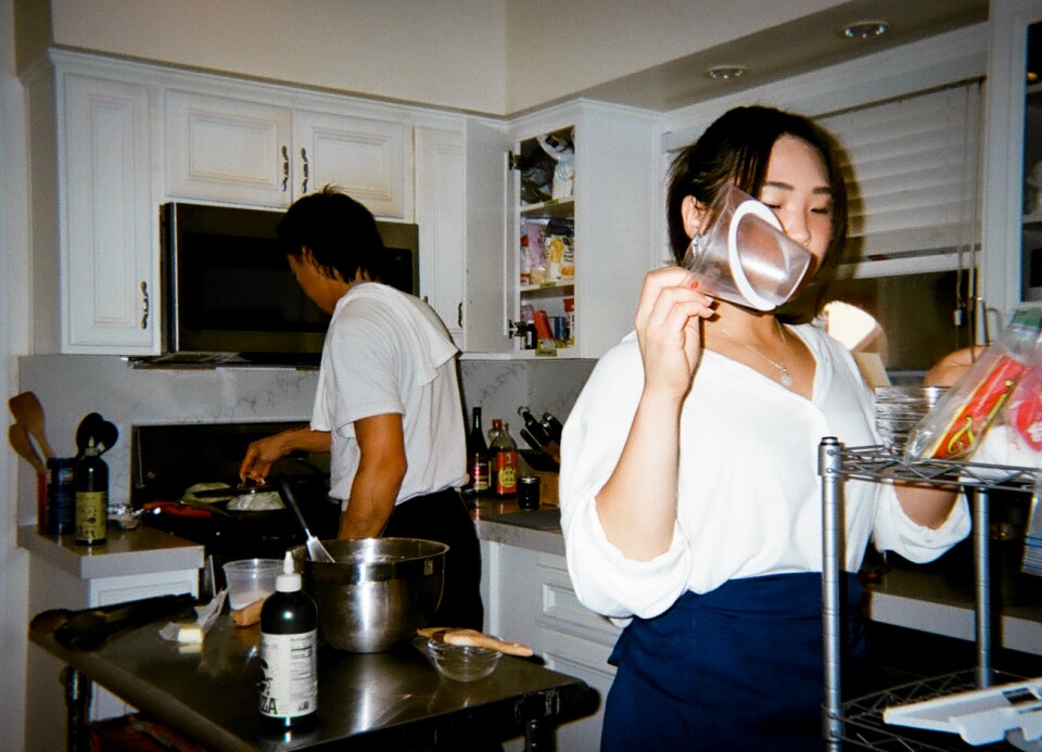 two people cooking in a home kitchen