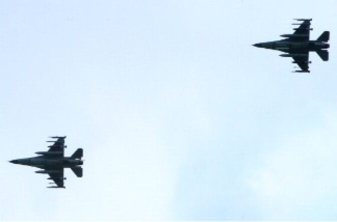 Two of the six Danish F16 fighter jets based in Italian military airport of Sigonella, southern Italy, land at the base after a mission of the international air campaign against Moamer Kadhafi's forces on March 21, 2011.
