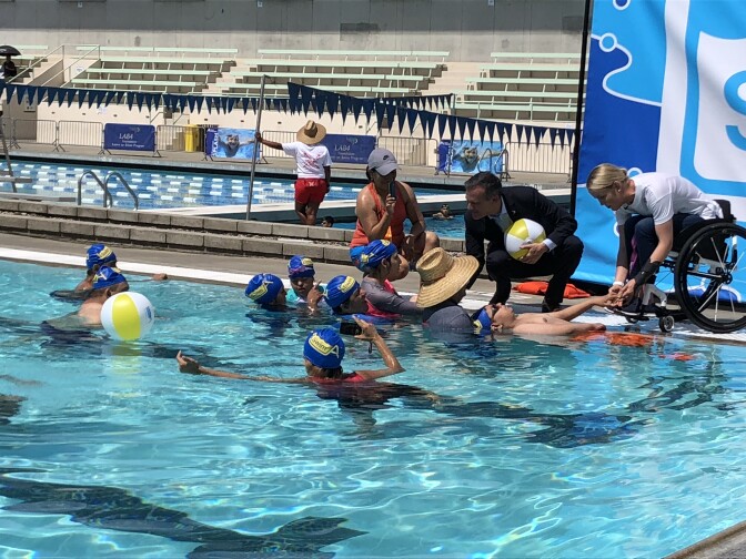Mayor Eric Garcetti speaks to swimmers at the the EXPO Center pool in Exposition Park where he announced swim lessons for L.A. kids for little to no cost.