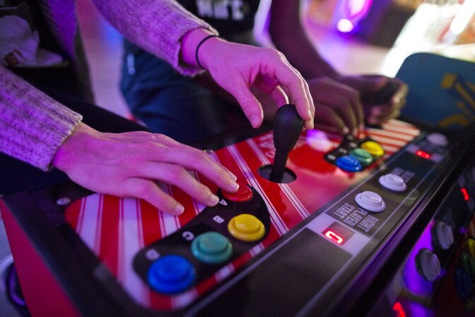 Nicole and husband Blake Bolton play Wind Jammers at Neon Retro Arcade in Pasadena on Wednesday afternoon, Feb. 4.
