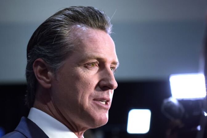 California Governor Gavin Newsom speaks to the press in the spin room after the sixth Democratic primary debate of the 2020 presidential campaign season co-hosted by PBS NewsHour & Politico at Loyola Marymount University in Los Angeles, California on December 19, 2019. (Photo by Agustin PAULLIER / AFP) (Photo by AGUSTIN PAULLIER/AFP via Getty Images)