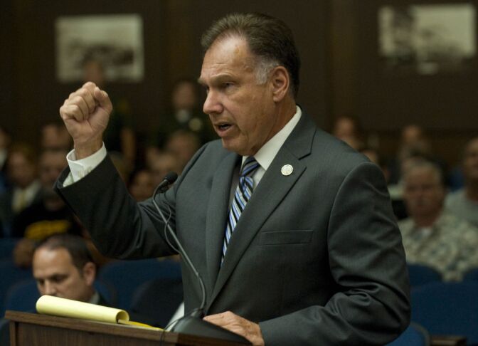 Tony Rackauckas, Orange County's elected district attorney, simulates what he believes to be, blows to Kelly Thomas' head with a taser by Fullerton police officer Jay Cicinelli.