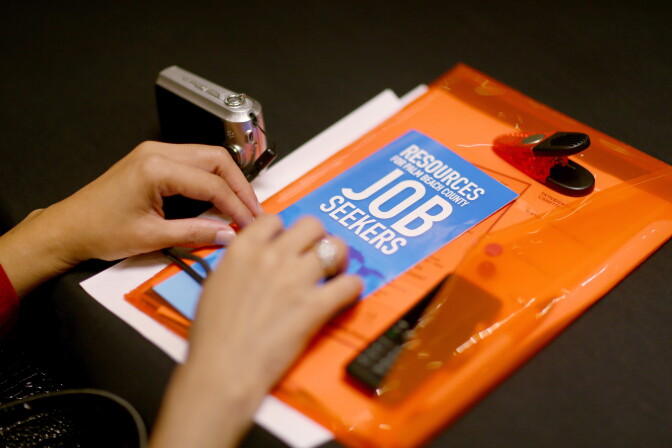 WEST PALM BEACH, FL - NOVEMBER 07:  A job seeker holds employment papers as she attends the Choice Career Fair on November 7, 2013 in West Palm Beach, Florida. The federal government, Bureau of Labor Statics, is scheduled to release the jobs report, tomorrow, which should give economist an idea about the state of the economy before and during the fiscal crisis that partially shutdown the government for 16 days, threatening the economic recovery.  (Photo by Joe Raedle/Getty Images)