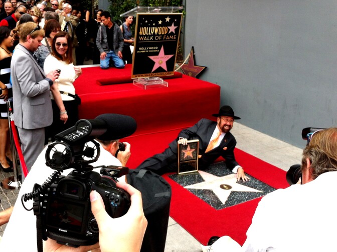 The cripplingly shy Shotgun Tom Kelly poses with his star on the Hollywood Walk of Fame. That's Stevie Wonder in the upper left corner. 4/30/2013