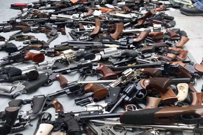 A photo released by LAPD shows a cache of over 1,000 firearms seized from a mansion in the Holmby Hills neighborhood of Los Angeles on Thursday, May 9, 2019. (Courtesy of LAPD)
