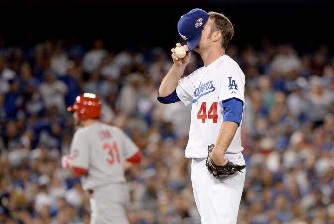 Pitcher Chris Withrow #44 of the Los Angeles Dodgers reacts after he is called for a balk in the fifth inning against the St. Louis Cardinals in Game Four of the National League Championship Series at Dodger Stadium on October 15, 2013 in Los Angeles, California.